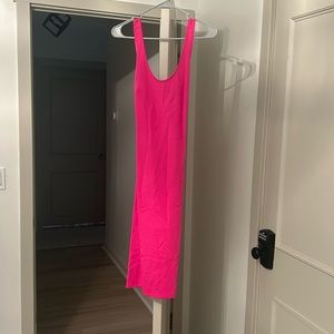 Hot pink bodycon dress . Criss cross in back worn 1 time